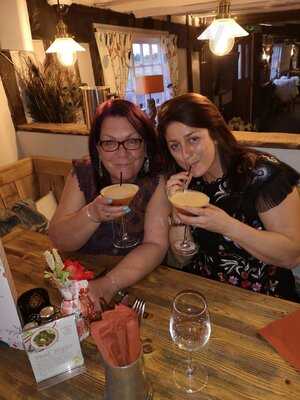 The Axe And Compasses